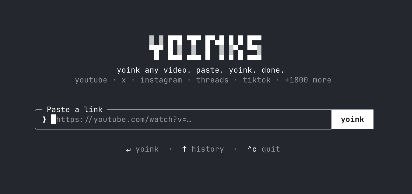 The yoinks home screen: the pixel wordmark, a framed “Paste a link” input with a placeholder youtube url, a yoink button, and footer hints reading “↵ yoink · ↑ history · ^c quit”.
